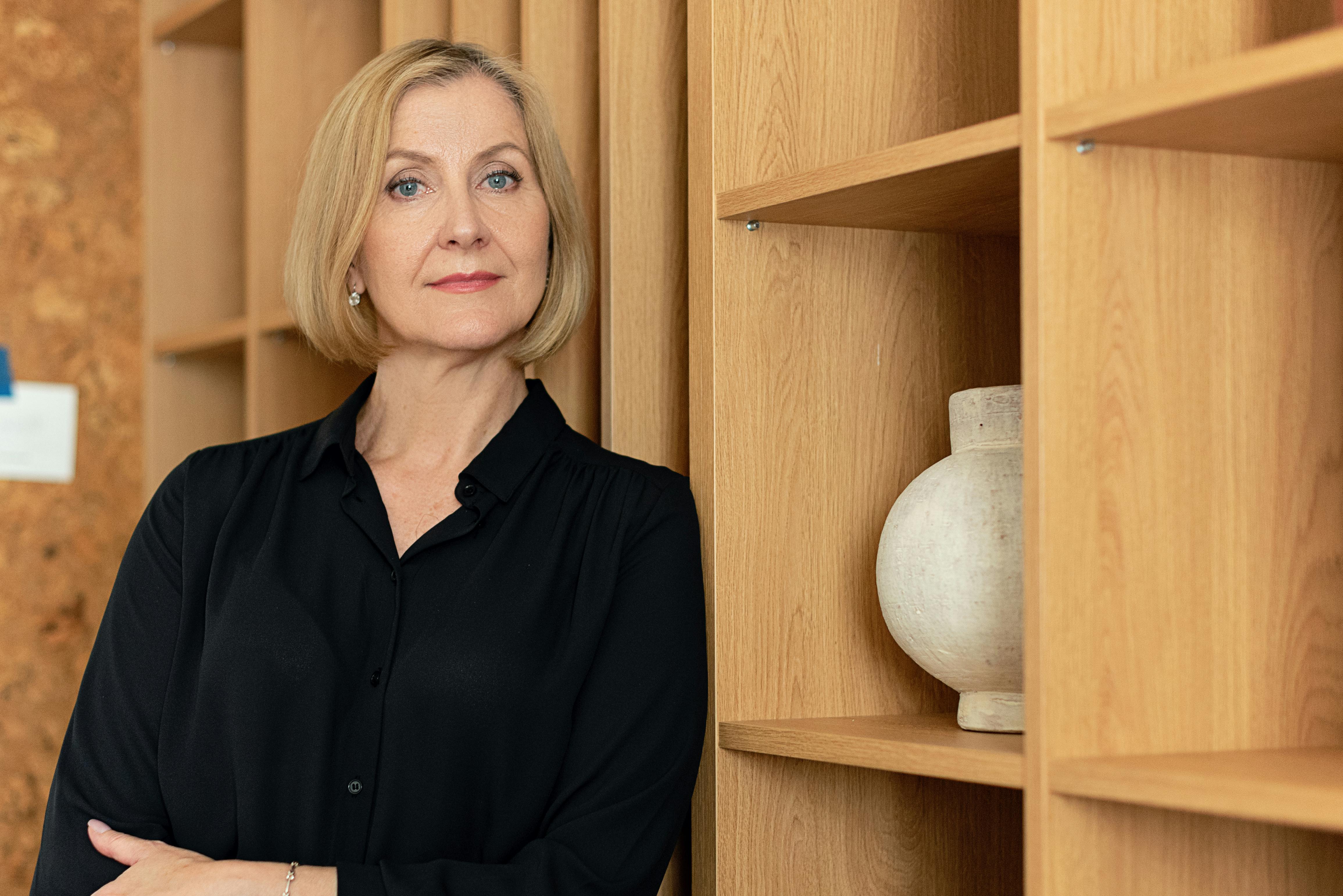 pexels-photo-8871904-8871904 Confident businesswoman standing in an office setting, showcasing leadership.